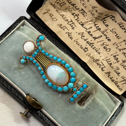 Lyre brooch